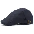 Detail of dark blue beret featuring textured breathable fabric and golden metal buckle - Adjustable / Navy Blue