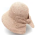 Close-up of fine woven straw texture and large bow detail on a wide brim sun hat - M (56-58cm) / Pink