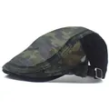 Close-up of camouflage mesh beret featuring adjustable metal buckle and breathable fabric - Black
