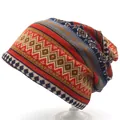 Detailed pattern of ethnic style knit beanie featuring geometric diamonds and red stripes - M (56-58cm) / Orange