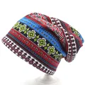 Detail of bohemian geometric knit pattern on a versatile red and blue slouchy beanie hat - M (56-58cm) / Blue