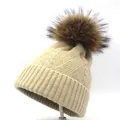 Close-up of the beige cable knit pattern and premium brown real fur pompom on beanie - M(56-58cm) / Beige