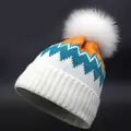 Winter-Strickmütze mit weißem Bommel und buntem Zickzack-Muster in Blau und Orange - Erwachsene / Orange Seeblau