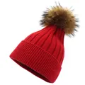 Detailed view of red ribbed knit beanie with a fluffy brown faux fur pom pom decoration - M (56-58cm) / Red