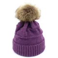 Close-up of deep purple knit beanie featuring thick texture and fluffy faux fur pompom - M / Purple