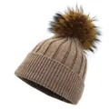 Detailed close-up of dark brown ribbed knit beanie with soft raccoon fur pompom and wide cuff - M (56-58cm) / Khaki