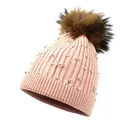 Pink knitted wool beanie for women featuring white pearls and a fluffy faux fur pompom - M (56-58cm) / Pink