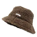 Detail of warm brown teddy faux fur bucket hat featuring a white lettered fabric patch - Coffee