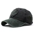 Close-up of a vintage-style maple leaf patch on a washed cotton baseball cap - Adjustable / Army Green Brim Black Top