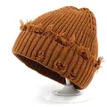 Brown distressed knit beanie with ribbed texture and fringe detailing on white stand - M (56-58cm) / Caramel color