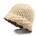 Detailed knit texture of beige crochet bucket hat with vintage wavy brim on stand - M (56-58cm) / Beige
