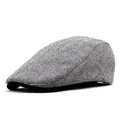 Side view of retro wool blend flat cap featuring grey herringbone texture and black brim - M (56-58cm) / Black