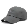Detailed close-up of white smile embroidery on a dark grey cotton baseball cap - M (56-58cm) / Gray