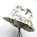Close-up of floral and bird prints on a silk-like off-white foldable bucket hat - M (56-58cm) / Pastoral Flower Bird Style / Beige