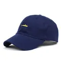 Detail of navy blue baseball cap featuring small yellow fish embroidery and cotton twill - M(56-58cm) / Navy Blue