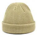 Detailed view of the khaki ribbed knit texture and folded cuff of the acrylic beanie - M / Beige
