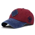 Detailed side view showing CANADA embroidery and maple leaf patch on cotton baseball cap - M (56-58cm) / Navy Brim Wine Red Top
