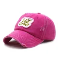 Detail of distressed rose red baseball cap with I do Crew embroidery and torn fabric edge - M / Rose Red