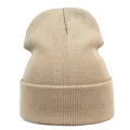 Detailed close-up showing the fine ribbed knit texture of this khaki acrylic beanie hat - M (56-58cm) / Beige