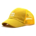 Detail of yellow mesh trucker hat with white embroidered letter m and breathable back - Approx. 52cm / Yellow