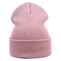 Close-up of soft pink knitted beanie with vertical ribbed texture and wide folded cuff - M (56-58cm) / Dusty Pink