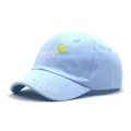 Detail of baby baseball cap with bebe embroidery, yellow crown, and Te Amo lettering - Blue