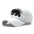 Detailed close-up of Yellowstone National Park bear embroidery on white cotton baseball cap - Adjustable / White
