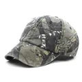 Detailed close-up of woodland camouflage cotton baseball cap with distressed brim effect - M (56-58cm) / Leaf Camouflage