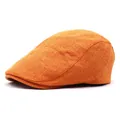 Detailweergave van de geweven linnen textuur op een feloranje heren newsboy pet - Verstelbaar / Oranje