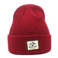 Close-up of deep red ribbed beanie showing the Wild Life mountain patch detail - M (56-58cm) / Red