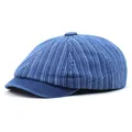 Detail of blue denim ivy cap featuring vertical stripe patterns and a vintage style brim - Adjustable / Dark Blue