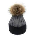 Close-up of ribbed knit wool beanie with raccoon fur pompom and color block design - M (56-58cm) / Dark Grey + Black