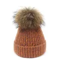 Warme gebreide dames muts voor de winter met grote pompon in de kleur burnt orange - M(56-58cm) / Oranje