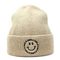 Detailed view of beige ribbed beanie featuring black smile embroidery and text - M (56-58cm) / Beige