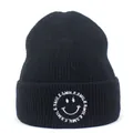 Close-up of black ribbed knit beanie featuring white Smile embroidery and letter logo - M (56-58cm) / Black