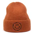 Detailed texture of caramel knit beanie featuring black smile face embroidery on the cuff - M (56-58cm) / Caramel color