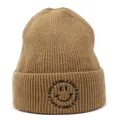 Close-up of the ribbed knit texture and black smile embroidery on the khaki beanie - M (56-58cm) / Brown