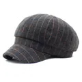 Macro detail of retro grey and orange plaid cotton fabric on the newsboy cap crown - M / Gray