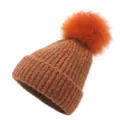 Close-up of orange ribbed knit beanie featuring a fluffy pom-pom and thick yarn texture - One Size / Orange