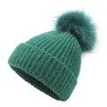 Deep teal knitted beanie with a large faux fur pom-pom shown on a clean white background - One Size / Green
