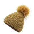 Ginger yellow knitted beanie with a large matching faux fur pompom for winter warmth - One Size / Yellow