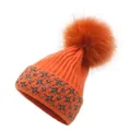 Detail of orange knitted beanie featuring a large fluffy pompom and silver glitter stars - M / Orange