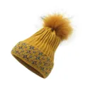 Close-up of ginger knitted beanie with silver glitter thread and sequin star patterns - M / Yellow