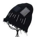 Detail of distressed black knit beanie with vintage patches and raw fringe edges - M (56-58cm) / Black