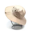 Detail of beige wide-brim sun hat with bronze ventilation eyelets and windproof drawstring - One Size / Beige