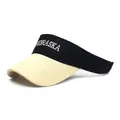 Detail of Nebraska embroidery and reinforced stitching on black and white sun visor - Beige