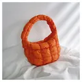 Mini quilted down cloud handbag in bright orange with soft padded texture and top handle - Orange