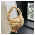 Mini khaki quilted dumpling bag featuring a puff pleated design and a soft single handle - Khaki