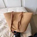 Large woven straw tote bag with dark brown leather handles for beach or summer vacation - Khaki