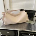 Pink pebbled leather tote bag with wide shoulder strap and metal ring detail - Pink